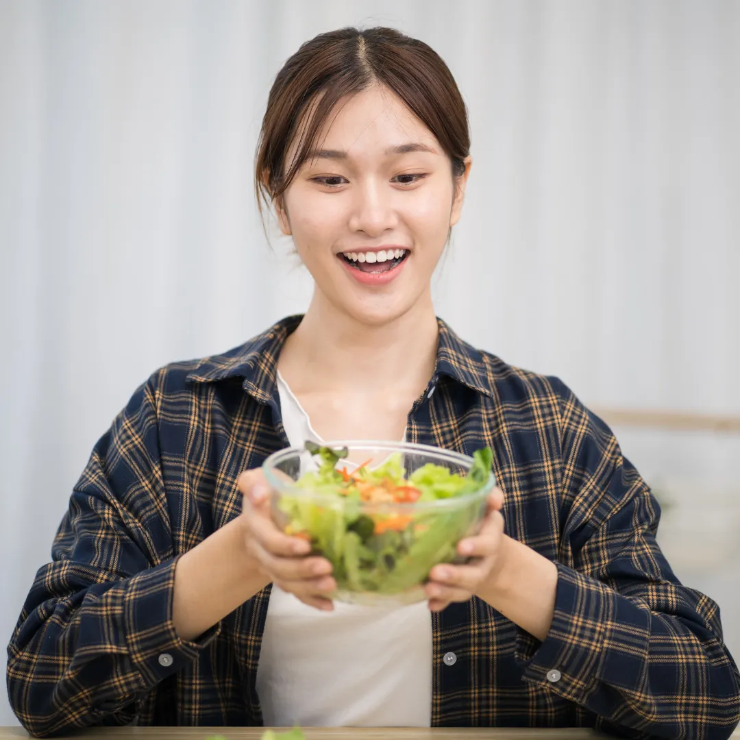 A smiling man, representing healthy eating without starving.